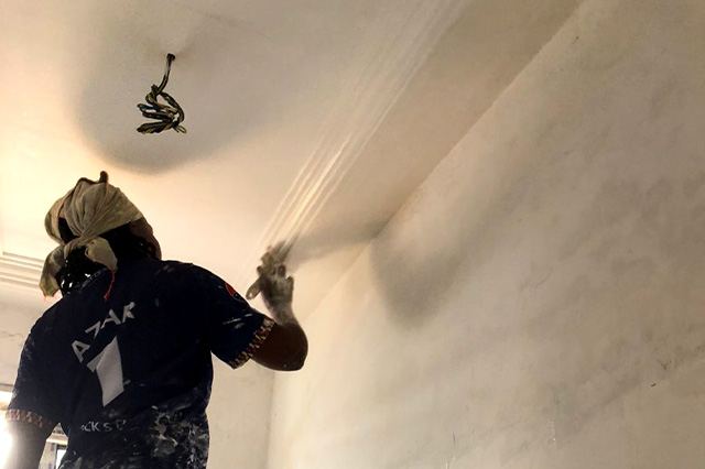 Painter finishing a ceiling